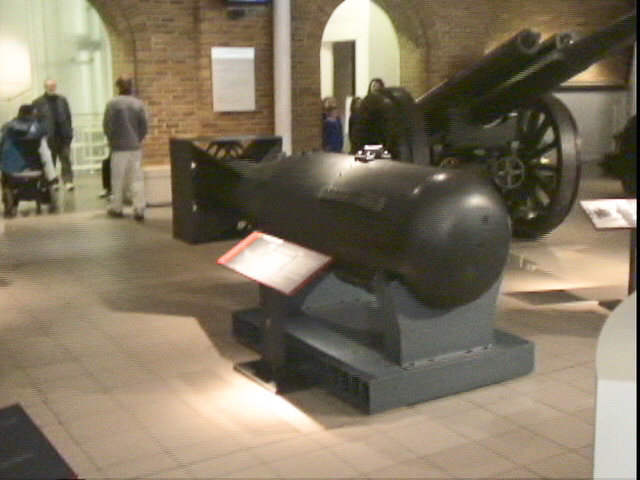 London040106-00356.jpg - Casing of a Little Boy atomic bomb, British 60 Pounder Field Gun (background)