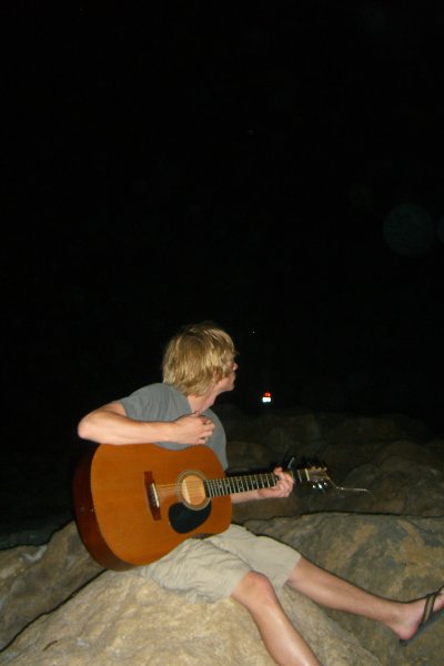 CIMG8325.JPG - Mike on the beach at Redfish Pass, playing guitar