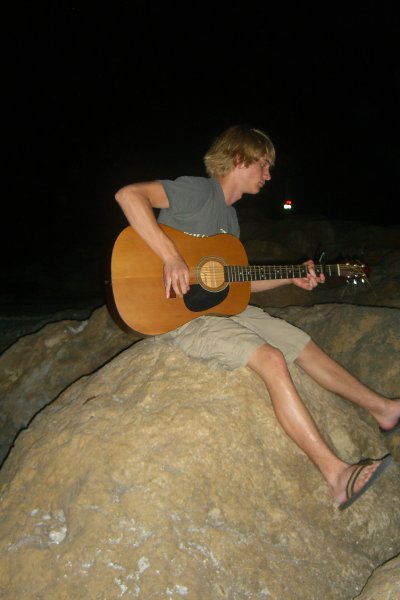 CIMG8326.JPG - Mike on the beach at Redfish Pass, playing guitar
