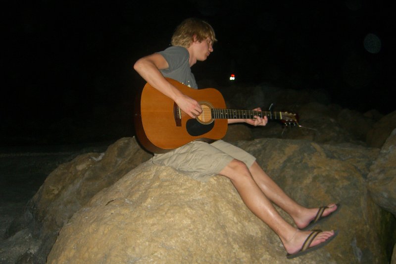 CIMG8327.JPG - Mike on the beach at Redfish Pass, playing guitar