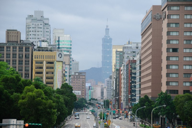 Taiwan060210-3227.jpg - On the Zhong Xiao East Road pedestrian bridge, looking East at Taipei 101 building. Sheraton Taipei (right)