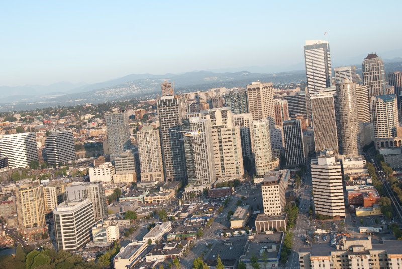 Seattle080309-8359.jpg - Airplane Flying Across Downtown Seattle Skyline as viewed from the SE side of the Space Needle