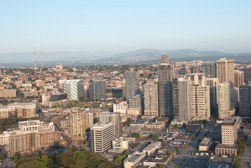 Seattle080309-8361.jpg - Airplane Flying Across Downtown Seattle Skyline as viewed from the SE side of the Space Needle