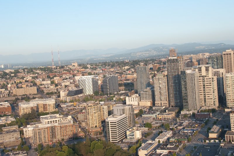 Seattle080309-8363.jpg - Airplane Flying Across Downtown Seattle Skyline as viewed from the SE side of the Space Needle