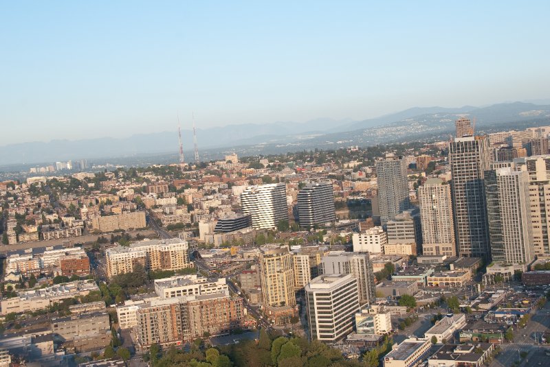 Seattle080309-8364.jpg - Airplane Flying Across Downtown Seattle Skyline as viewed from the SE side of the Space Needle