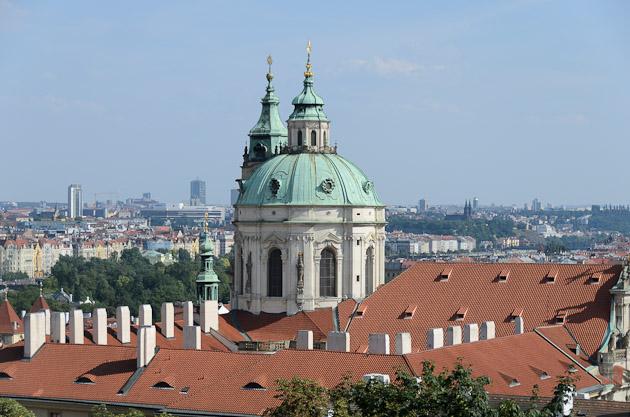 Dome of St. Nicholas Church (Malá Strana). View of Prague from Royal Garden. Pražský hrad / Prague Castle St. Nicholas Church